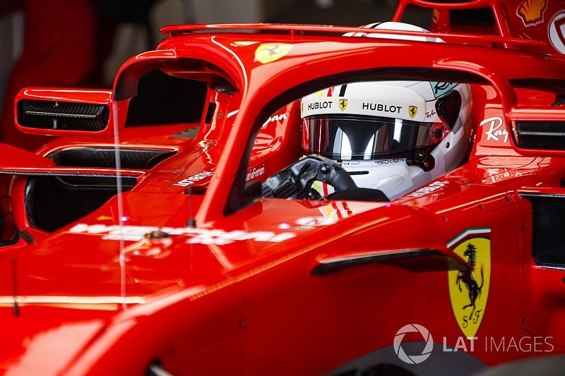 Unhappy Vettel stays silent on radio message