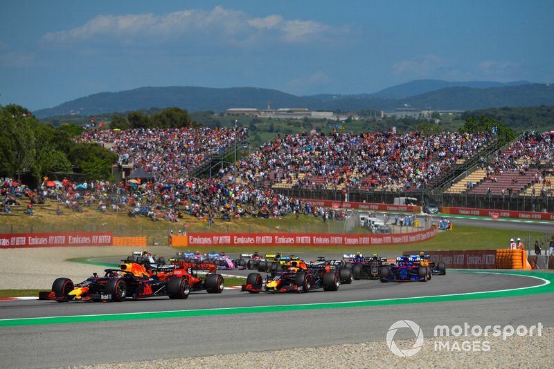 Max Verstappen, Red Bull Racing RB15, leads Charles Leclerc, Ferrari SF90, Pierre Gasly, Red Bull Racing RB15, and the remainder of the field at the start