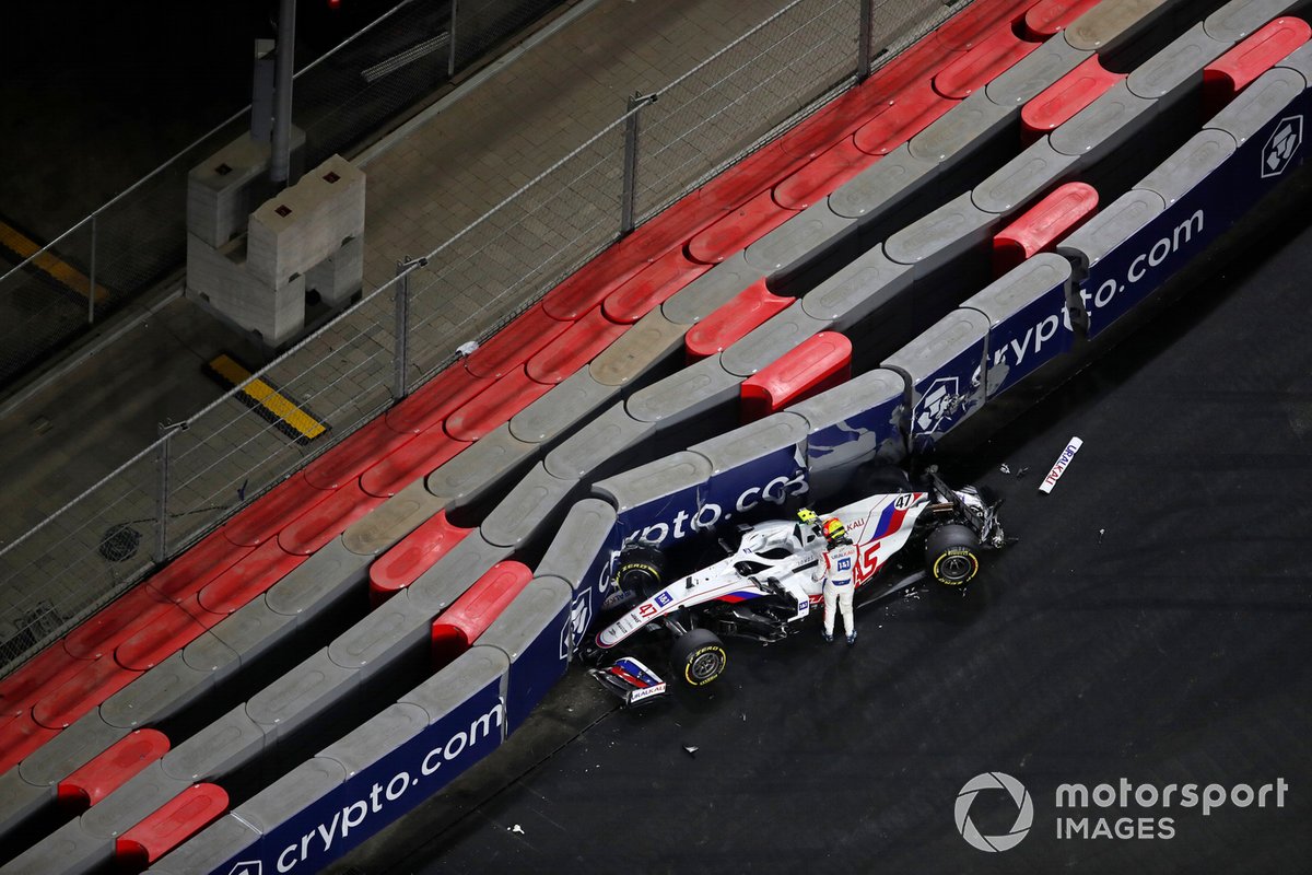 Mick Schumacher, Haas VF-21, climbs out of his car after crashing out of the race