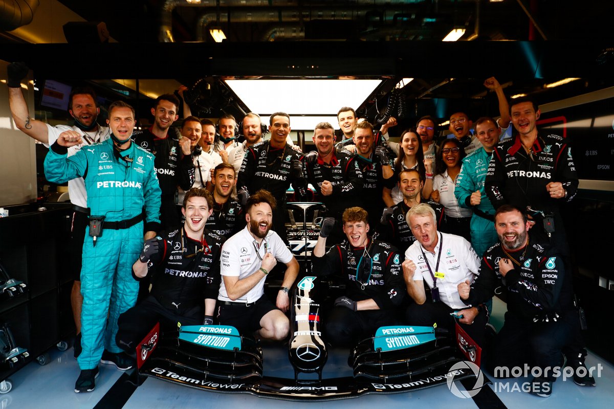 Mercedes team members with the car of Valtteri Bottas, Mercedes W12, in the garage