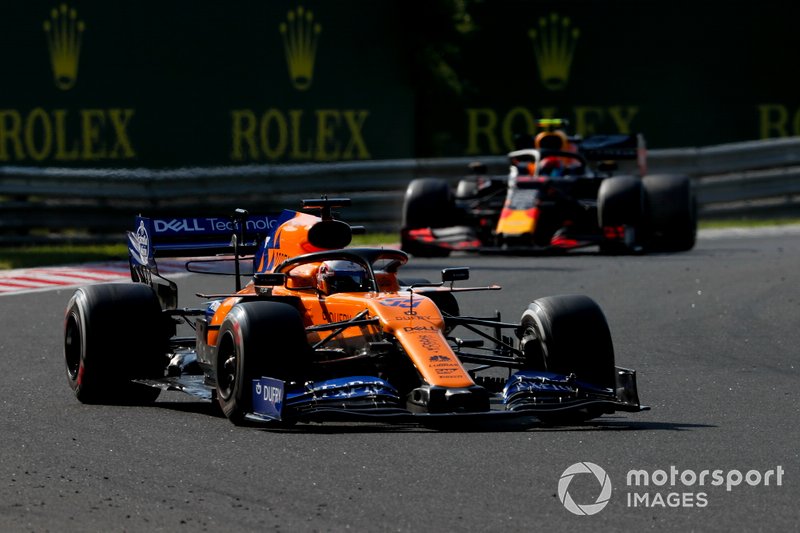 Carlos Sainz Jr., McLaren MCL34, leads Pierre Gasly, Red Bull Racing RB15