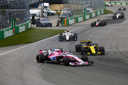 A sideways Sergio Perez, Force India VJM11, battles with Carlos Sainz Jr., Renault Sport F1 Team R.S
