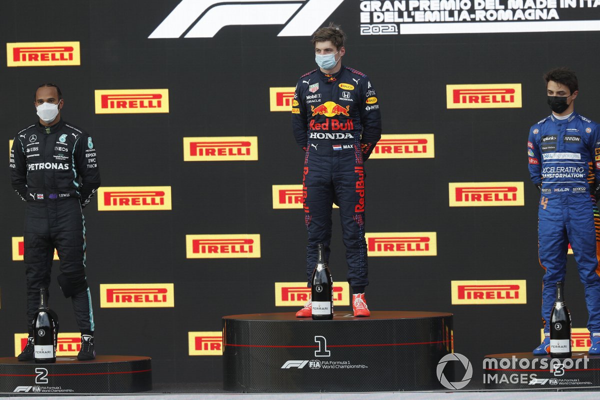 Lewis Hamilton, Mercedes, 2nd position, Max Verstappen, Red Bull Racing, 1st position, and Lando Norris, McLaren, 3rd position, on the podium