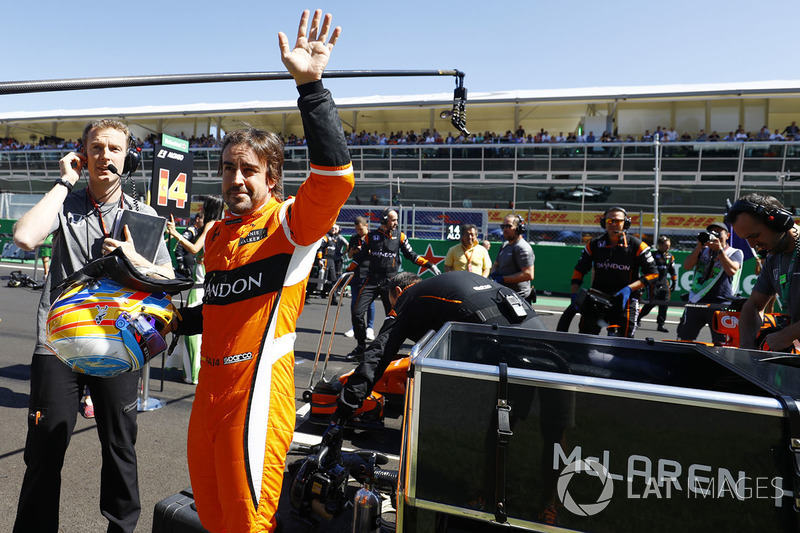 Fernando Alonso, McLaren, waves to fans