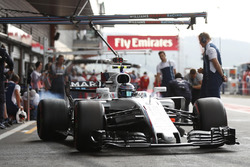 Lance Stroll, Williams FW40, burns rubber in the pit lane
