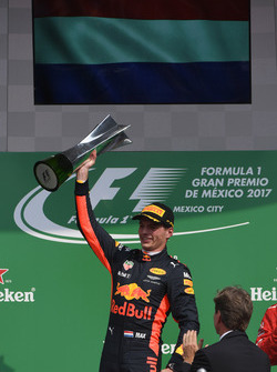 Race winner Max Verstappen, Red Bull Racing celebrates on the podium with the trophy
