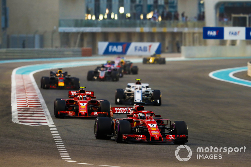 Sebastian Vettel, Ferrari SF71H, leads Kimi Raikkonen, Ferrari SF71H, and Charles Leclerc, Sauber C37, and Daniel Ricciardo, Red Bull Racing RB14