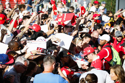 Kimi Raikkonen, Ferrari, signs autographs for fans