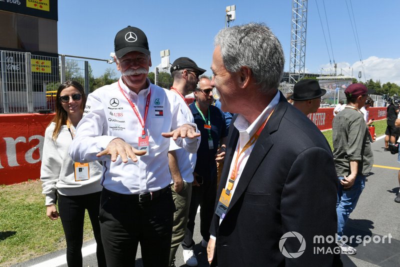 Dr Dieter Zetsche, CEO, Mercedes Benz, and Chase Carey, Chairman, Formula 1, on the grid