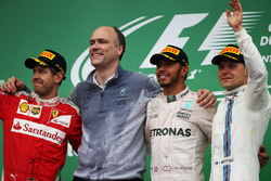 The podium (L to R): Sebastian Vettel, Ferrari, second; Lewis Hamilton, Mercedes AMG F1, race winner
