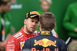 Sebastian Vettel, Ferrari en Max Verstappen, Red Bull Racing in parc ferme