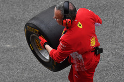 Ferrari mechanic with Pirelli tyre