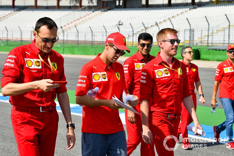 Sebastian Vettel, Ferrari walks the track with his mechanics