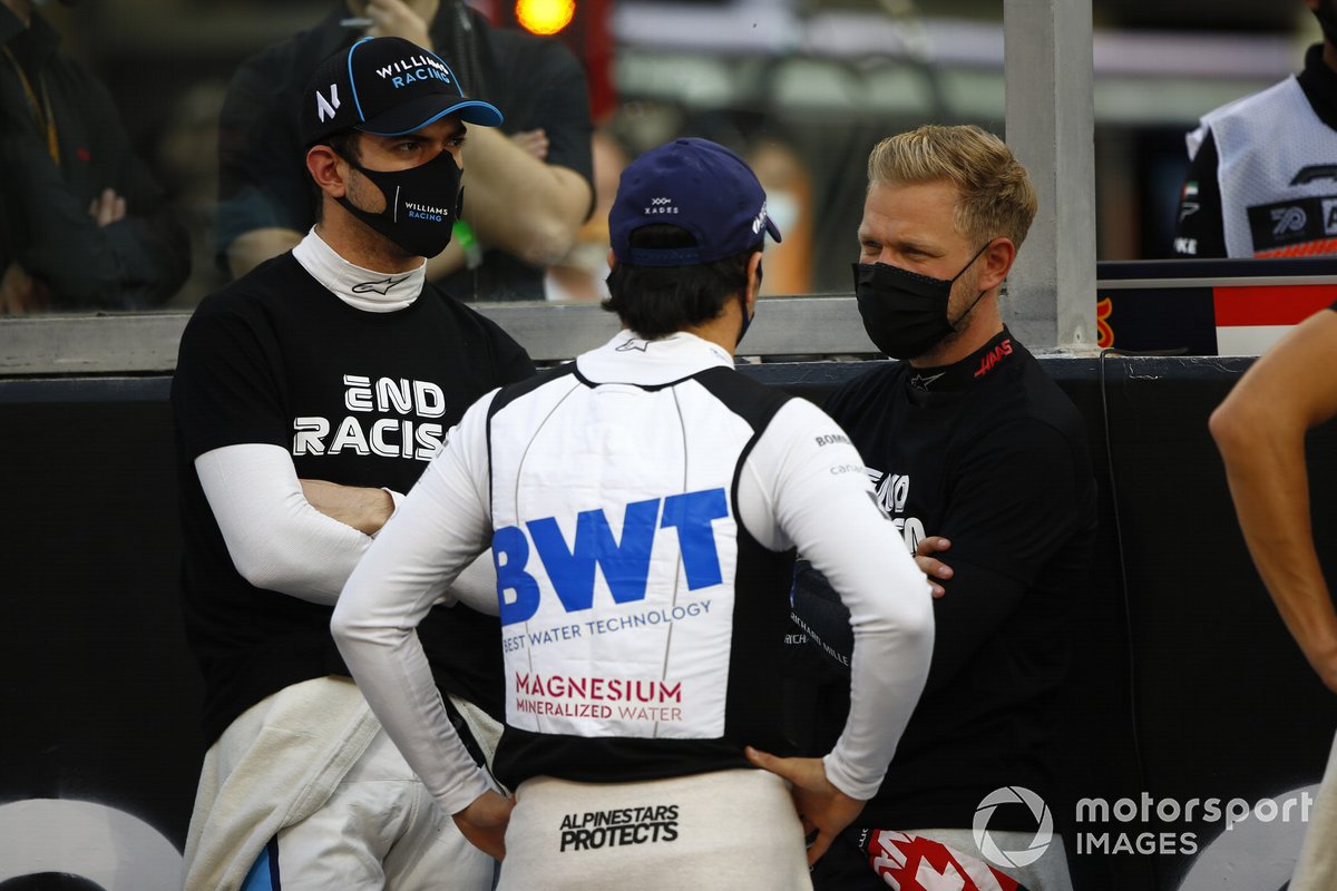 Nicholas Latifi, Williams Racing, Sergio Perez, Racing Point, and Kevin Magnussen, Haas F1, on the grid