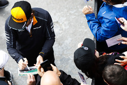 Fernando Alonso, McLaren, signs autographs for fans