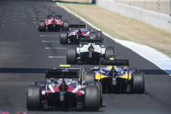 Cars line up on the grid for the start