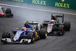 Felipe Nasr, Sauber C35 and Jenson Button, McLaren MP4-31 battle for position