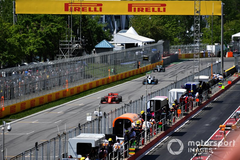 Sebastian Vettel, Ferrari SF90, leads Robert Kubica, Williams FW42, andLewis Hamilton, Mercedes AMG F1 W10