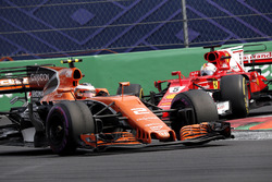 Sebastian Vettel, Ferrari SF70H and Stoffel Vandoorne, McLaren MCL32 battle