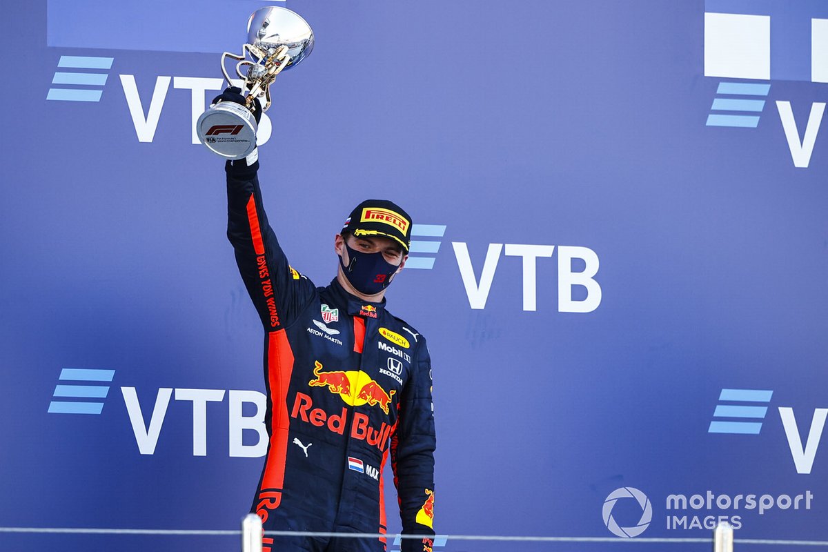 Max Verstappen, Red Bull Racing celebrates on the podium with the trophy