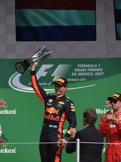 Race winner Max Verstappen, Red Bull Racing celebrates on the podium with the trophy