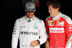 (L to R): Pole sitter Lewis Hamilton, Mercedes AMG F1 with third placed Sebastian Vettel, Ferrari in