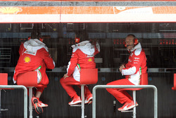 Ferrari engineers at work in the pit gantry