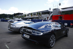 A pair of Red Bull branded Aston Martins in the paddock