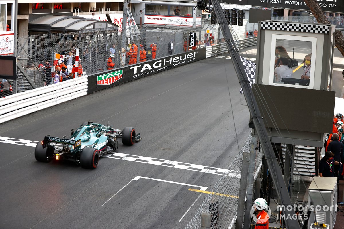 Lance Stroll, Aston Martin AMR21, crosses the line as the chequered flag is waved Tennis star by Serena Williams