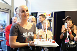 Skier Lindsey Vonn is given a birthday cake by Daniel Ricciardo, Red Bull Racing, Max Verstappen, Re