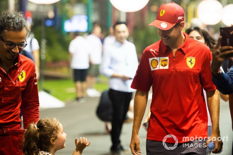 Sebastian Vettel, Ferrari, speaks to a young fan