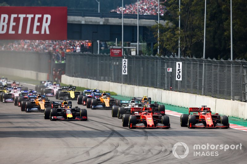 Charles Leclerc, Ferrari SF90, leads Sebastian Vettel, Ferrari SF90, Lewis Hamilton, Mercedes AMG F1 W10, Max Verstappen, Red Bull Racing RB15, Carlos Sainz Jr., McLaren MCL34, and the rest of the field at the start