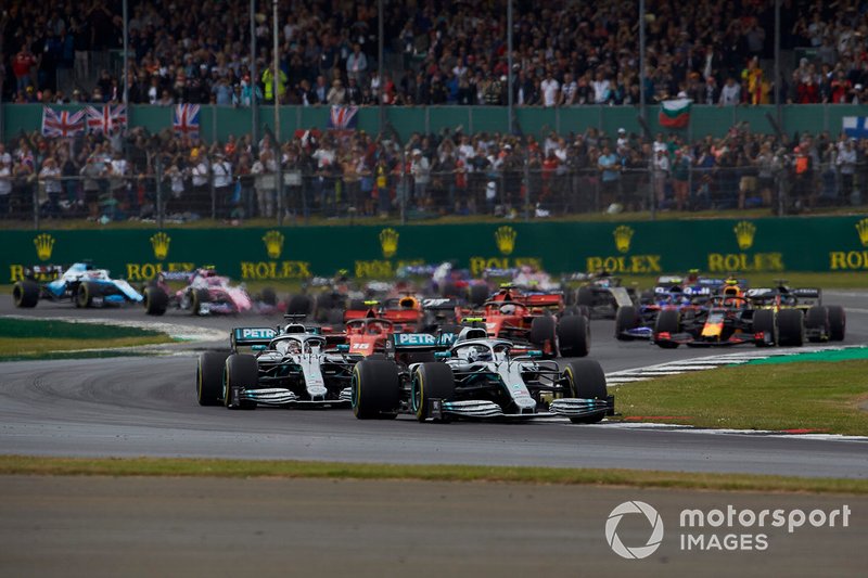 Valtteri Bottas, Mercedes AMG W10, leads Lewis Hamilton, Mercedes AMG F1 W10, Charles Leclerc, Ferrari SF90, Max Verstappen, Red Bull Racing RB15, Sebastian Vettel, Ferrari SF90, Pierre Gasly, Red Bull Racing RB15, and the rest of the field at the start
