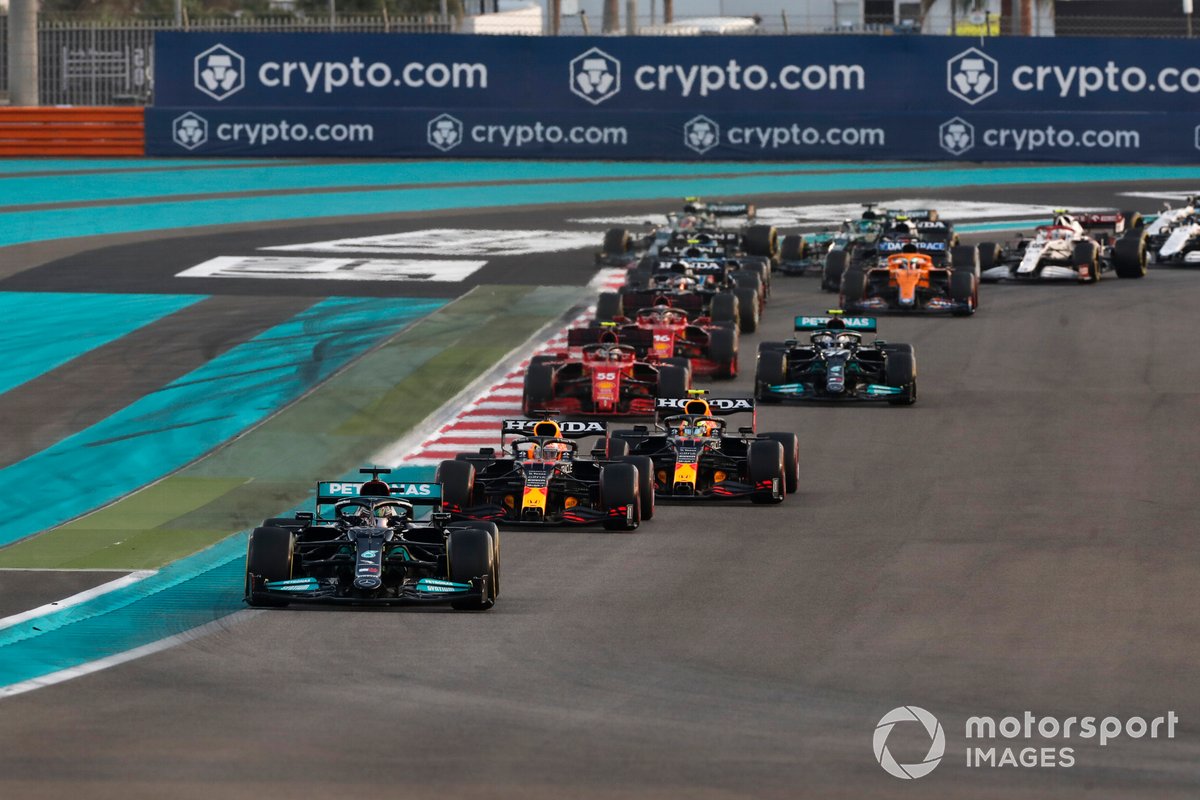 Lewis Hamilton, Mercedes W12, Max Verstappen, Red Bull Racing RB16B, Sergio Perez, Red Bull Racing RB16B, the rest of the field as Lando Norris, McLaren MCL35M, runs wide