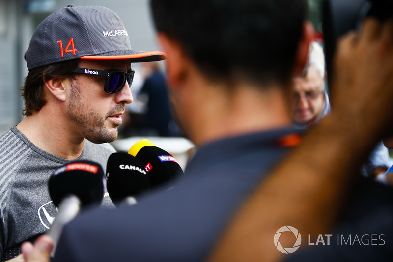 Fernando Alonso, McLaren, talks to press