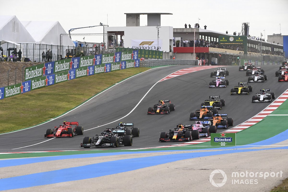 Lewis Hamilton, Mercedes F1 W11, Valtteri Bottas, Mercedes F1 W11, Max Verstappen, Red Bull Racing RB16, leads, Sergio Perez, Racing Point RP20, and the rest of the field at the start