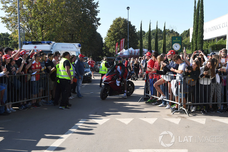 Lewis Hamilton, Mercedes AMG F1 arrives at the track on his motorbike