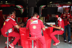 Ferrari engineers in the pit garage central console