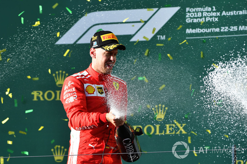 Race winner Sebastian Vettel, Ferrari celebrates on the podium with the champagne