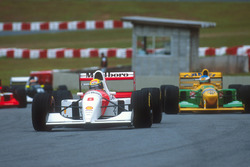 Ayrton Senna, McLaren MP4/8 Ford leads Michael Schumacher, Benetton B192B Ford