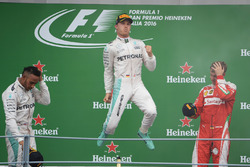 The podium (L to R): second place Lewis Hamilton, Mercedes AMG F1; Race winner Nico Rosberg, Mercede