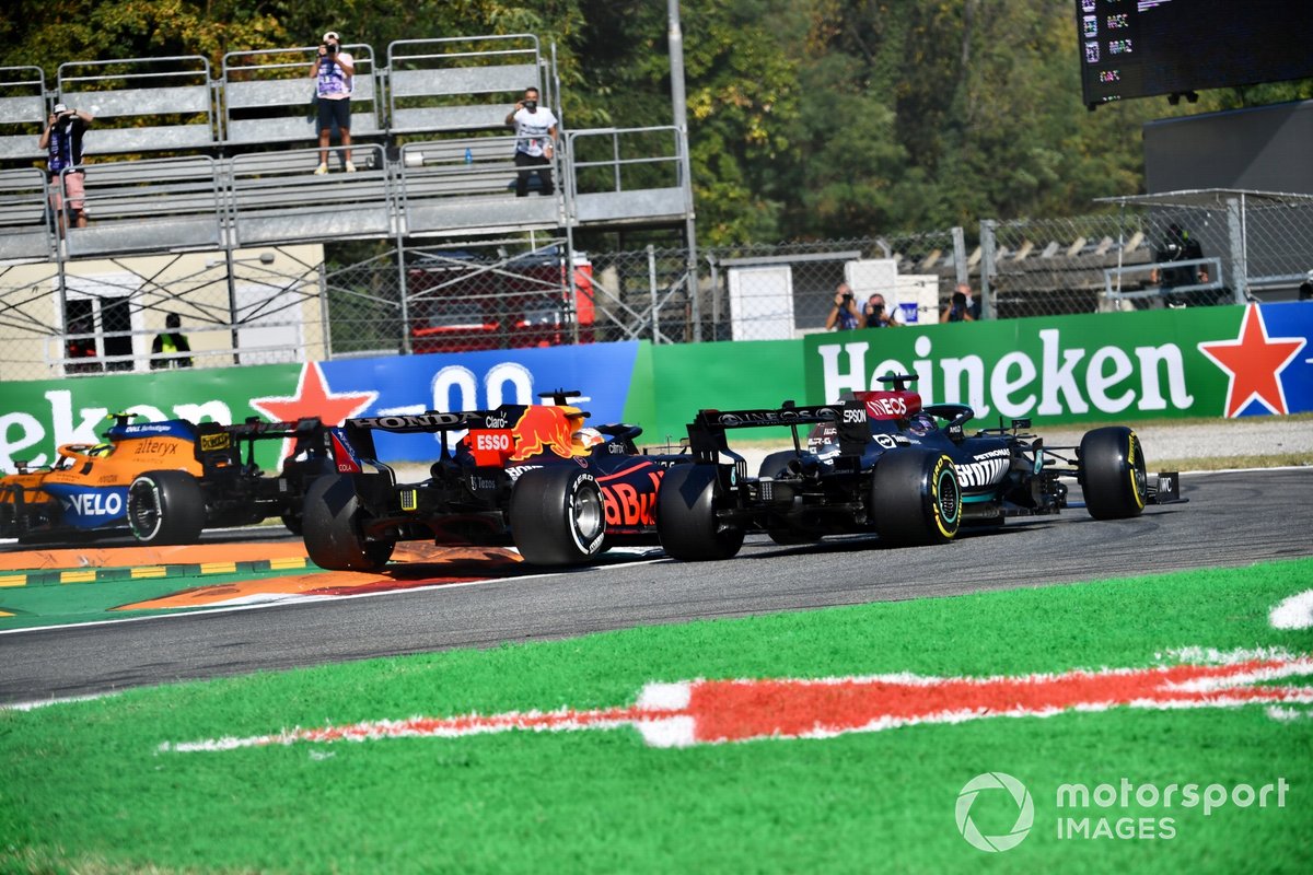 Max Verstappen, Red Bull Racing RB16B, and Lewis Hamilton, Mercedes W12, crash out
