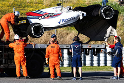 The Williams FW40 of Lance Stroll, Williams is recovered on the back of a truck