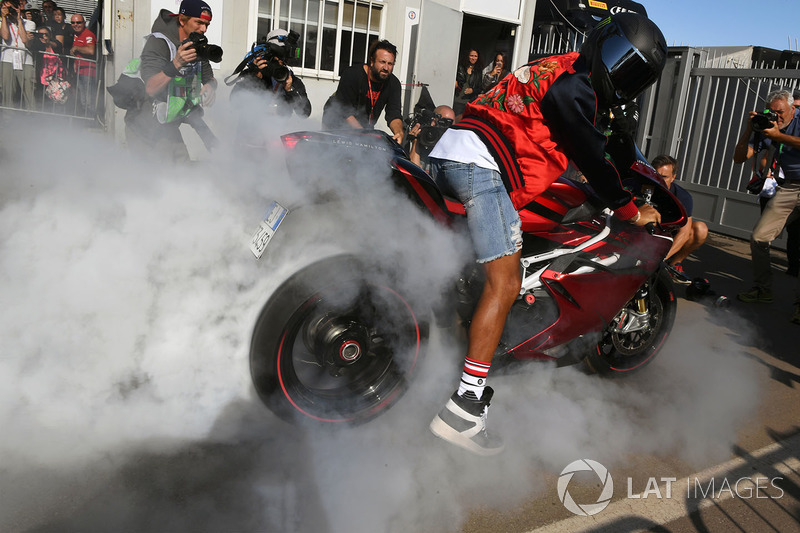 Lewis Hamilton, Mercedes AMG F1 does a burnout on his motorbike