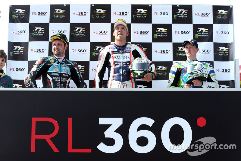 RL360º Superstock TT race winner Peter Hickman celebrates with runner up Michael Dunlop and third pl