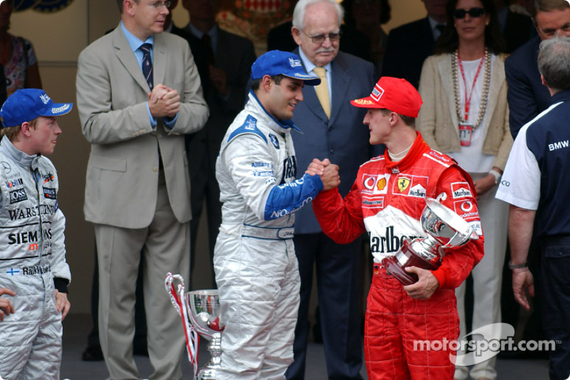 Podio: ganador de la carrera Juan Pablo Montoya, Kimi Raikkonen y Michael Schumacher