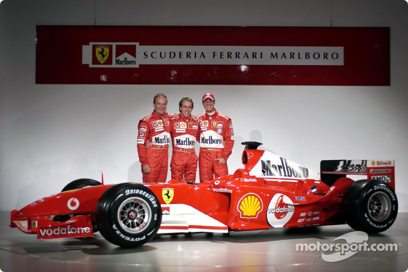 Rubens Barrichello, Luca Badoer and Michael Schumacher with the new Ferrari F2004