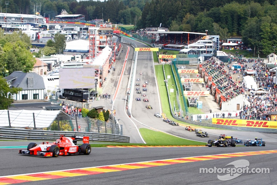 Josef Kral leads the field on the opening lap of the race