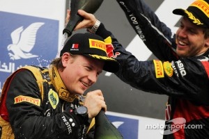 Kimi Raikkonen, Lotus F1 Team celebrates his second position on the podium with race winner Sebastian Vettel, Red Bull Racing