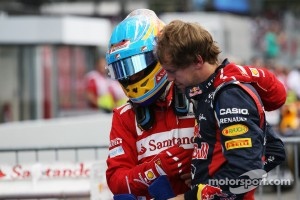 Race winner Fernando Alonso, Ferrari celebrates in parc ferme with Sebastian Vettel, Red Bull Racing